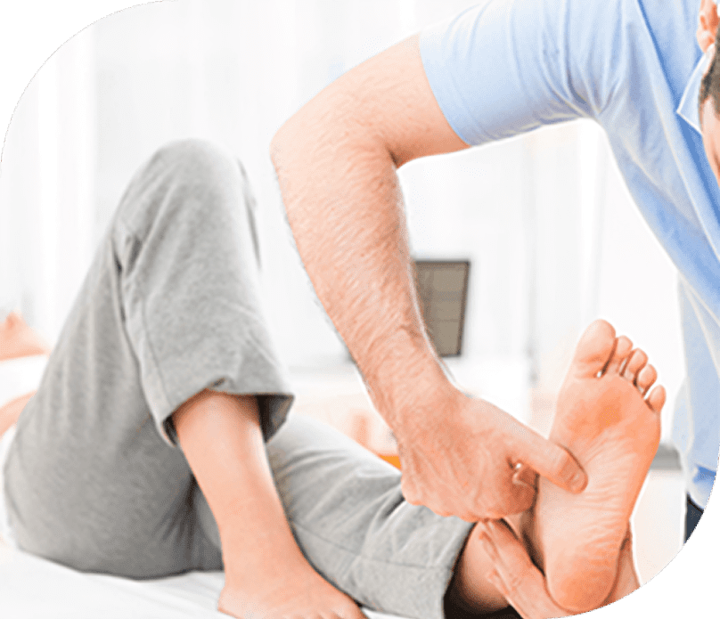 Therapist performing foot treatment